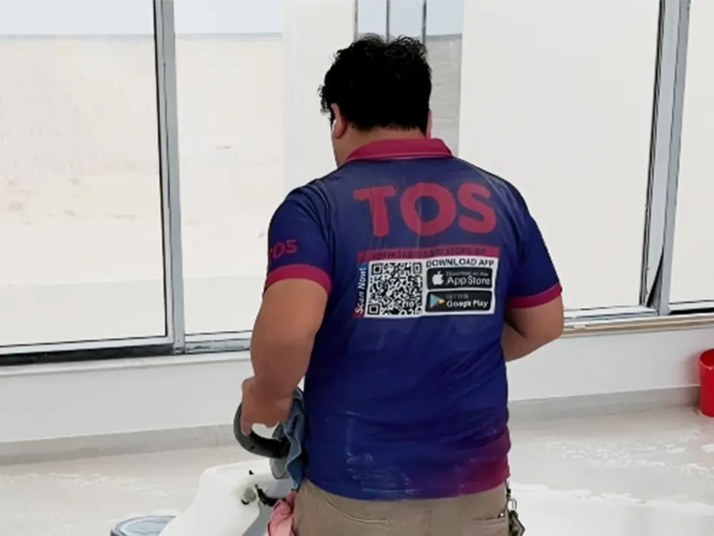 A TopOne cleaner deep cleaning a villa floor with a single-disc machine