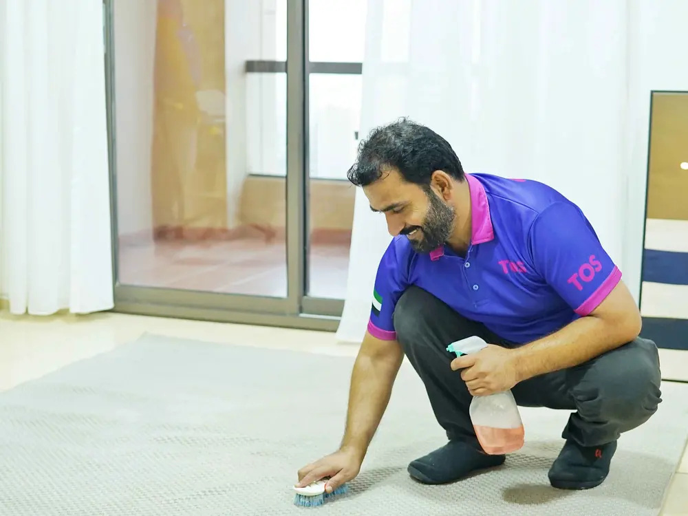 A TopOne cleaner deep cleaning a villa floor